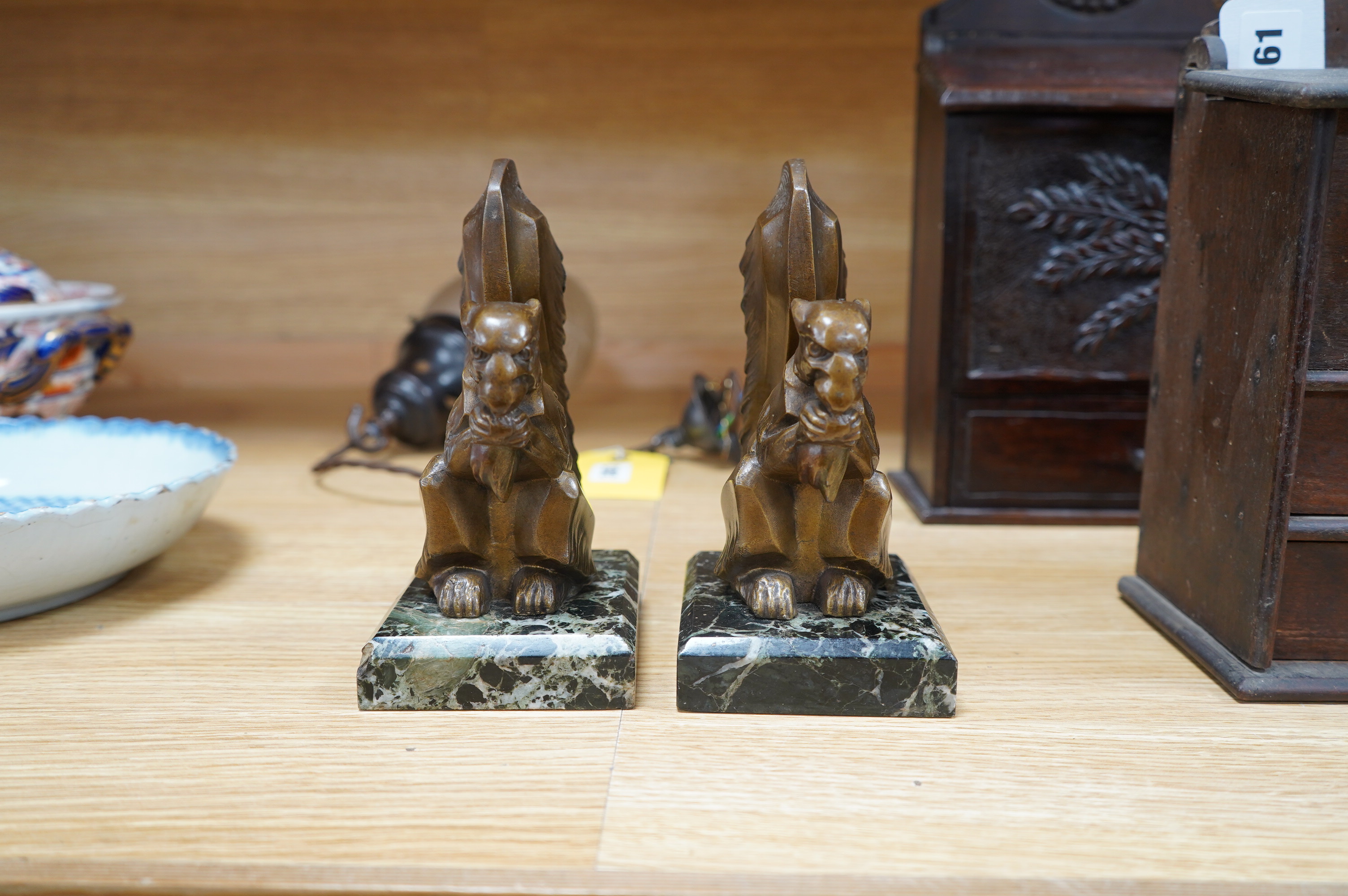 A pair of French Art Deco spelter squirrel bookends, on marble plinths, 18cm high. Condition - fair to good